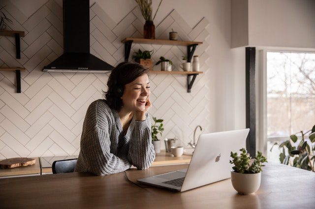Woman talking to someone online on her laptop