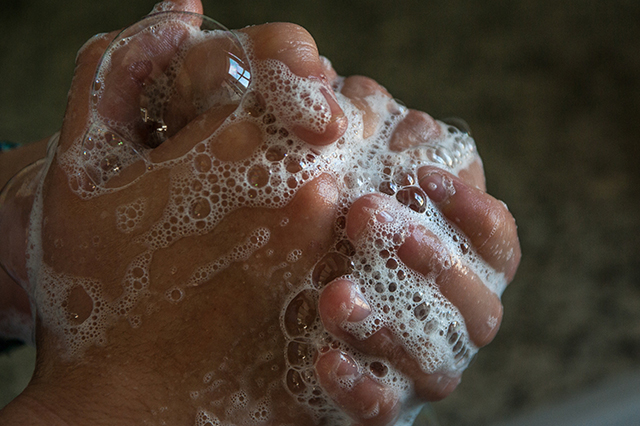 Close up of someone excessively washing their hands due to OCD
