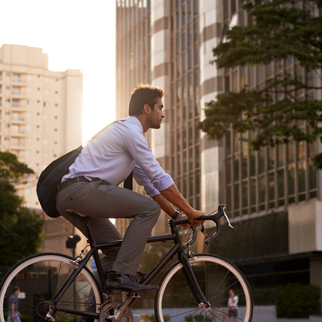 man in a city on a bicycle