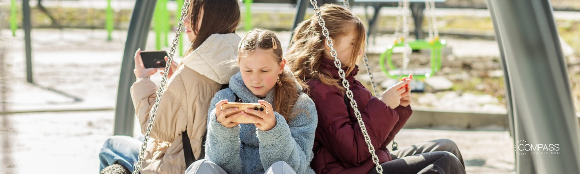 Three teens on phones
