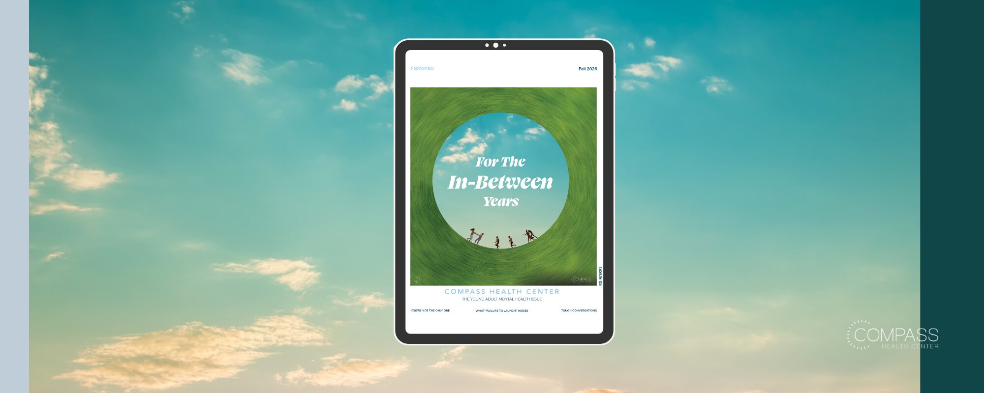 A tablet with an image of grass and clouds reads "For The In-Between Years: Forward Issue 03" against a cloudy background.